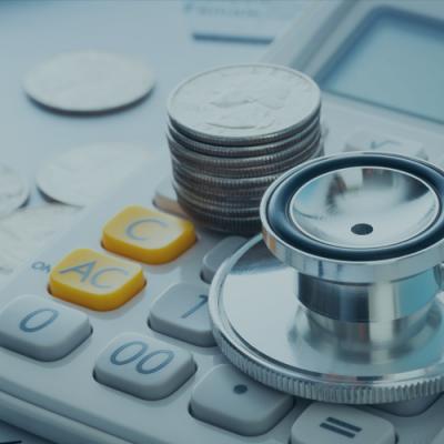 Close up photo of stethoscope, and hand calculator